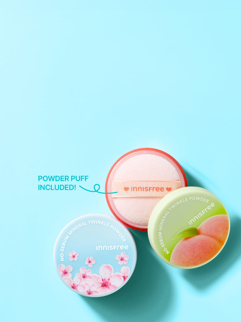 Three innisfree No-Sebum Mineral Twinkle Powders arranged on a light blue background, with one open pink puff and two closed lids showing printed designs. Text on the image says 'POWDER PUFF INCLUDED!'.
