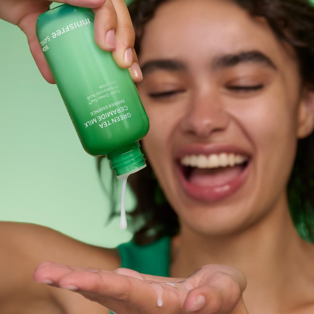 model holding Green Tea Ceramide Milk