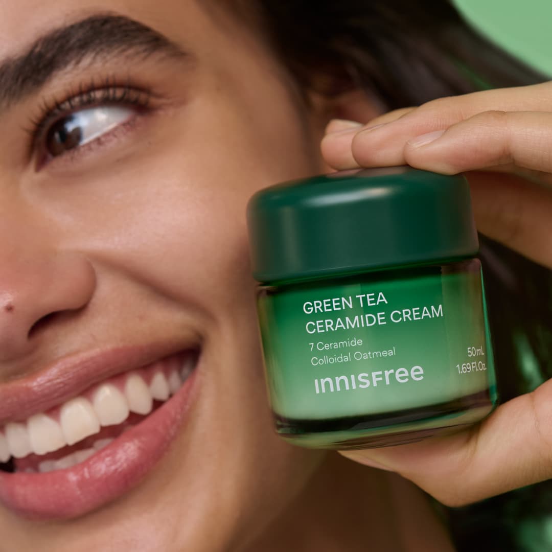 model holding Green Tea Ceramide Cream