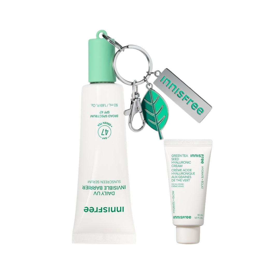 The Hydrated Defense Kit packshot featuring Green Tea Sunscreen Serum SPF 47 + keychain, and mini Green Tea Hyaluronic Cream