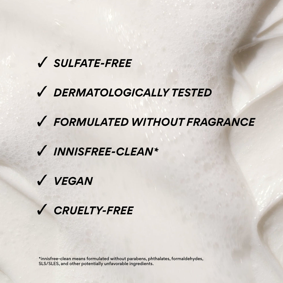 A close-up of a white creamy cleansing foam texture with black text listing product benefits: sulfate-free, dermatologically tested, formulated without fragrance, innisfree-clean*, vegan, and cruelty-free.