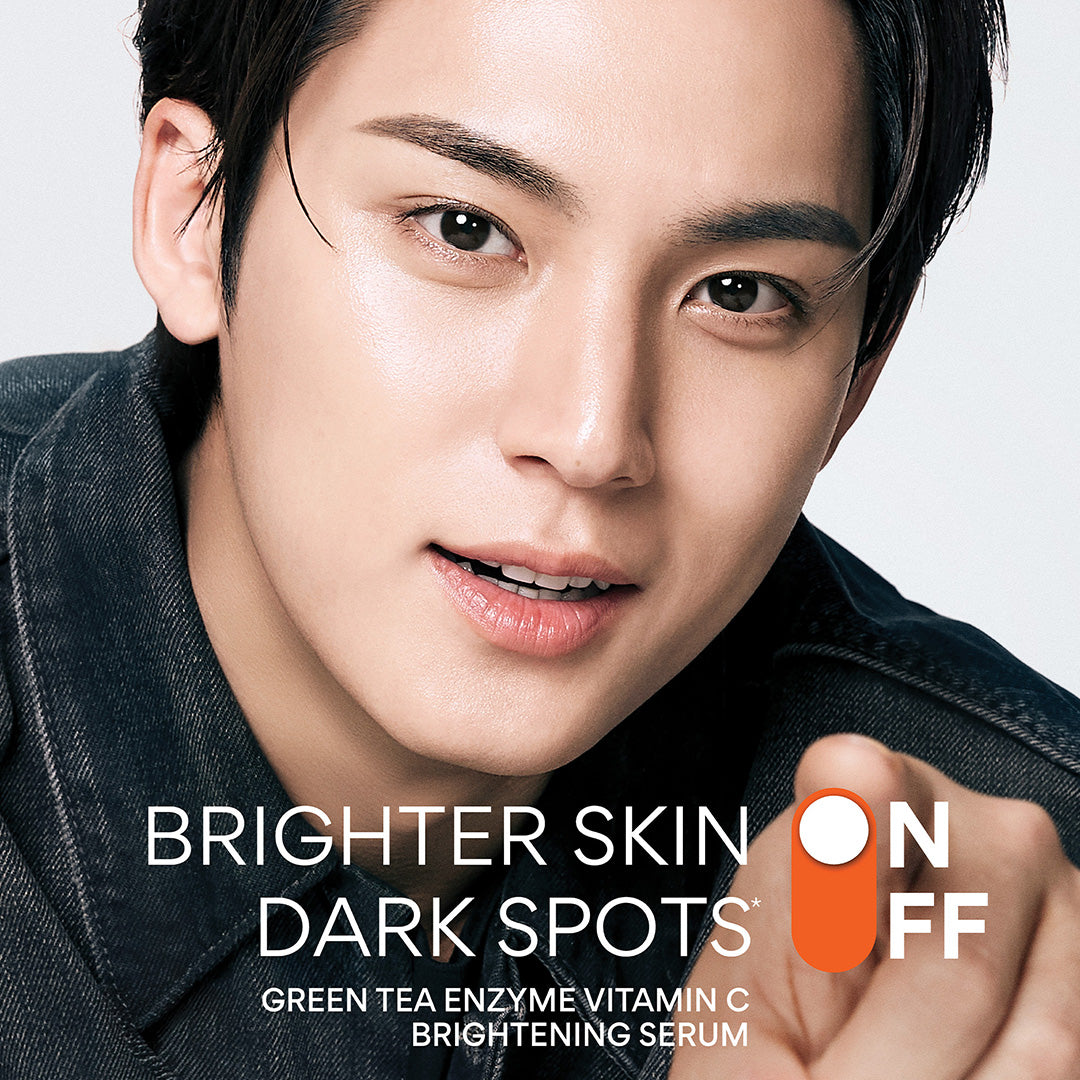 Global Korean Idol MINGYU with text overlay about Vitamin C Brightening Serum on a gray background