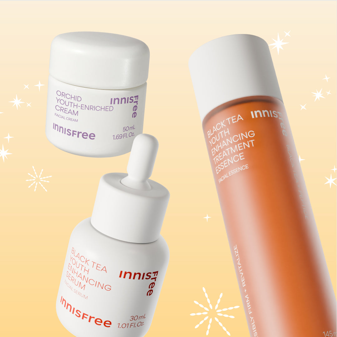 Three Innisfree skincare products arranged on a pale peach background with white starburst graphics: Orchid Youth-Enriched Cream, Black Tea Youth Enhancing Serum, and Black Tea Youth Enhancing Treatment Essence.