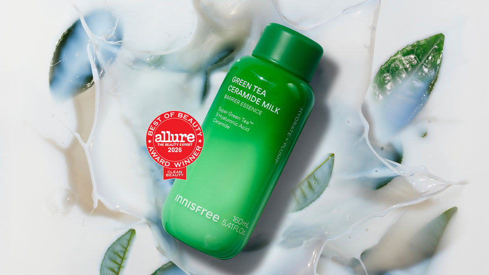 Innisfree Green Tea Ceramide Milk is shown on a white background with a milk splash and green tea leaves. A red Allure Best of Beauty 2026 award badge is overlaid on the left side of the bottle.