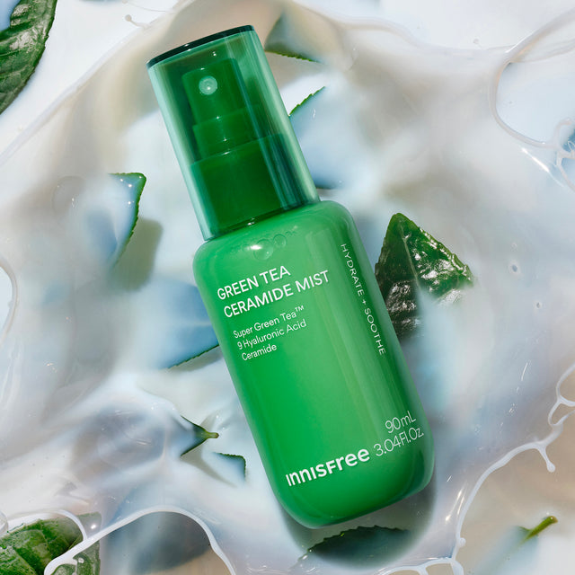 Innisfree Green Tea Ceramide Mist in a translucent green pump bottle, styled in a liquid cream composition.