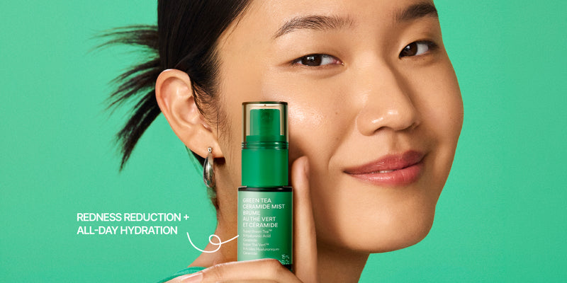 A woman with dark hair pulled back holds a green bottle of innisfree Green Tea Ceramide Mist 15mL against a solid green background. White text on the left reads 'REDNESS REDUCTION + ALL-DAY HYDRATION'.