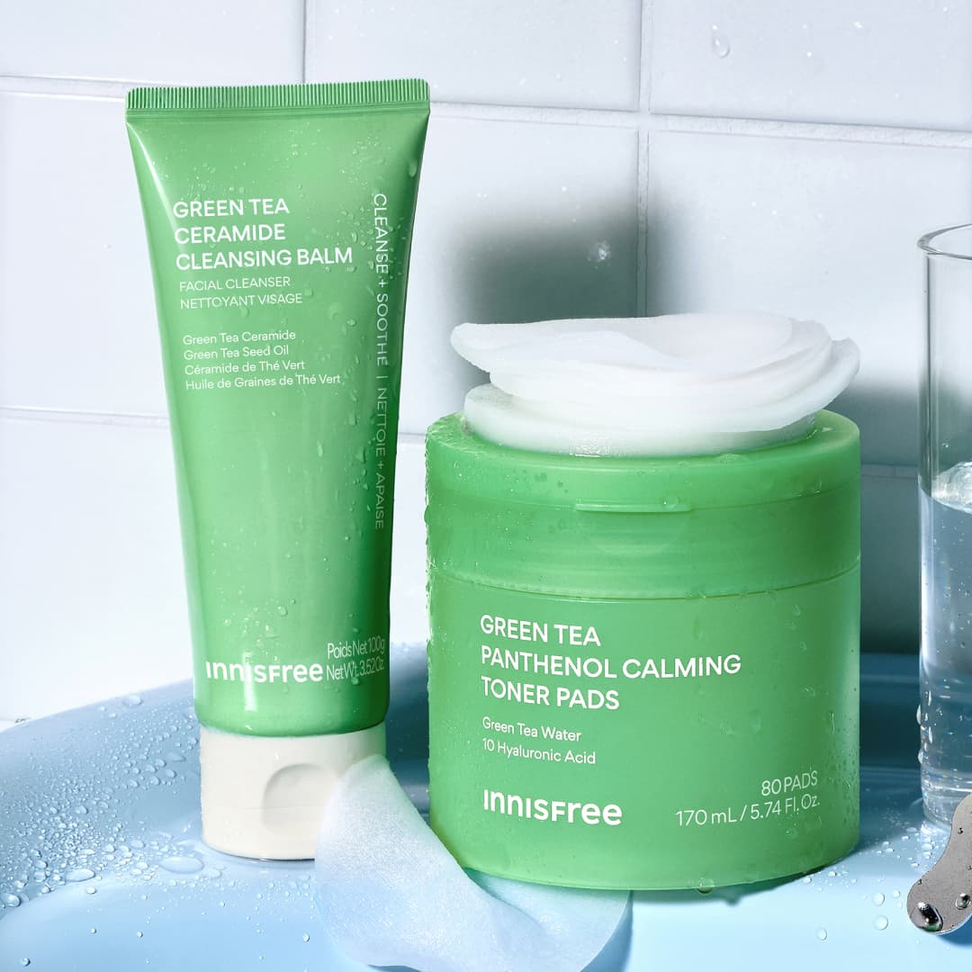 Green Tea Cleansing Balm and Green Tea Calming Toner Pads in a bathroom setting