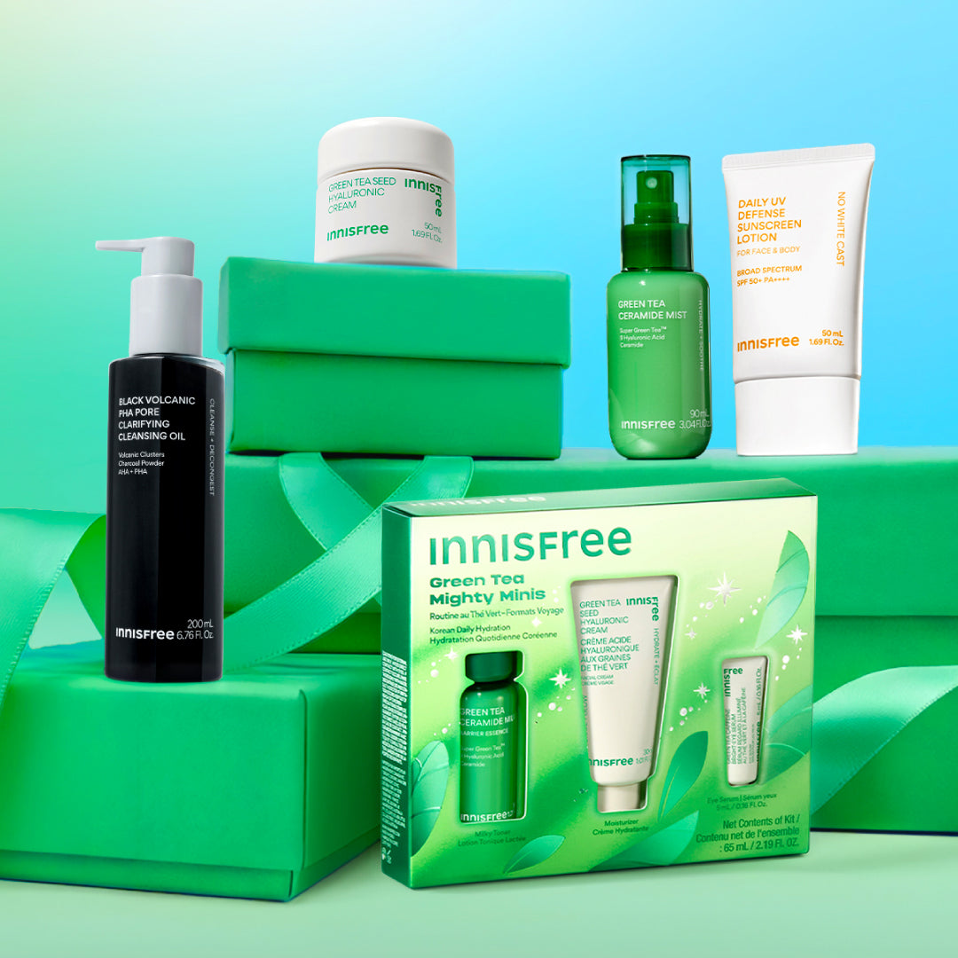 An Innisfree skincare gift set and products arranged on green boxes against a soft blue-green gradient background with ribbons