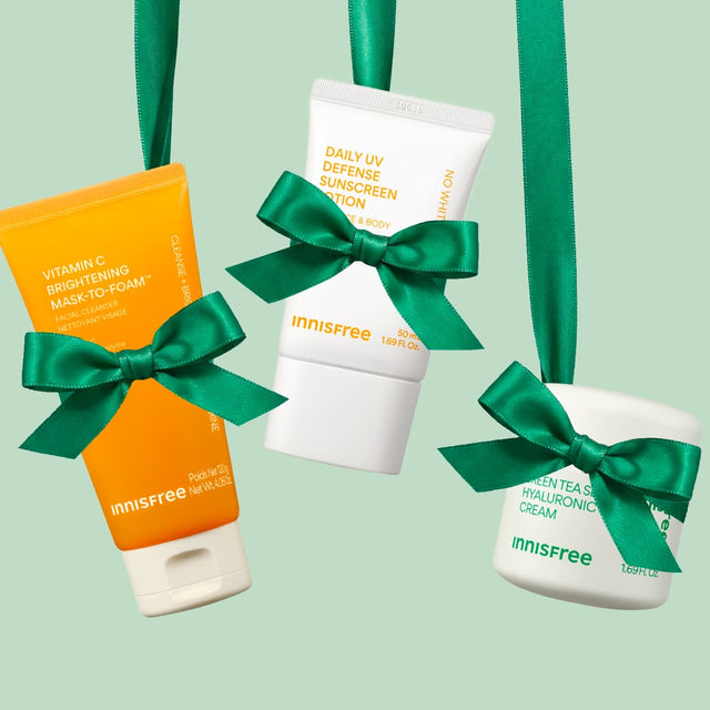 Vitamin C Mask-To-Foam™ Cleanser, Daily UV Sunscreen Lotion, Green Tea Cream in green bow wrapping
