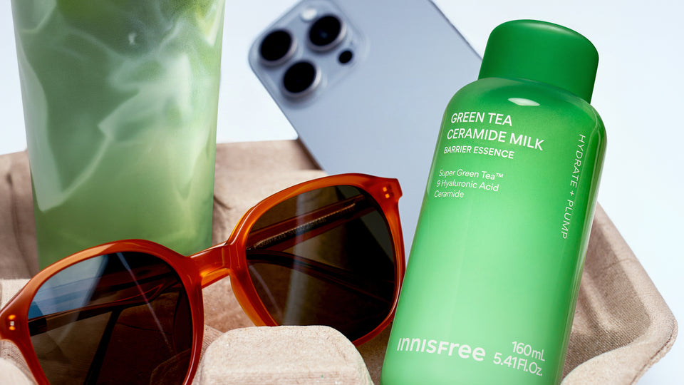Green Tea Ceramide Milk with sunglasses and phone background