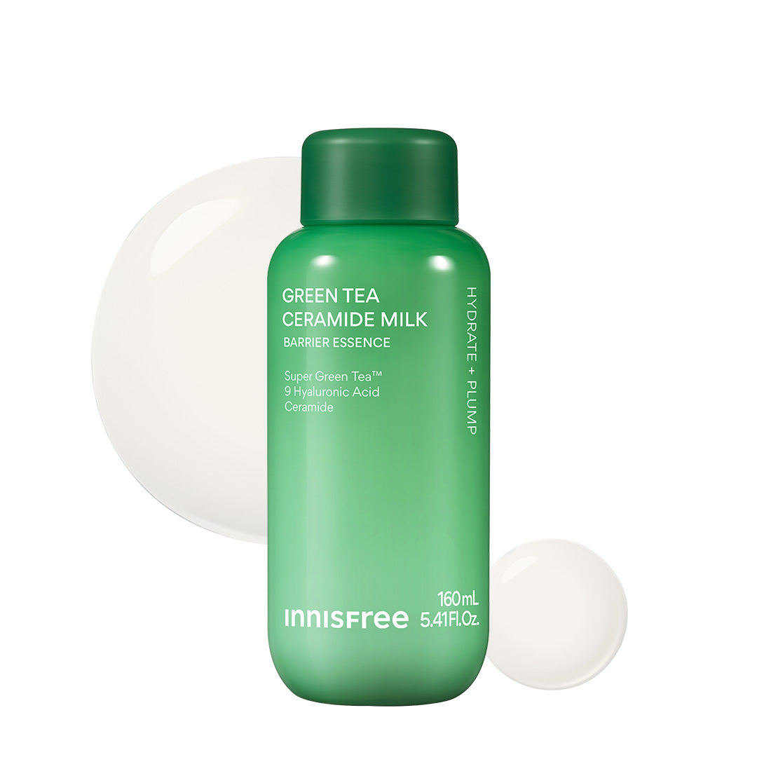 Innisfree Green Tea Ceramide Milk Barrier Essence in a 160mL green bottle, shown against a white background with two white circular gel spheres behind it.