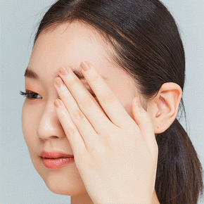 Model applying Green Tea Cleansing Oil to dissolve eye makeup GIF animation