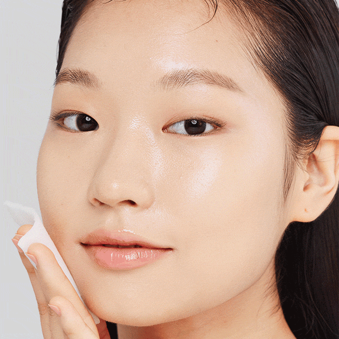 Model applying Green Tea Hyaluronic Acid Toner with cotton pad GIF animation