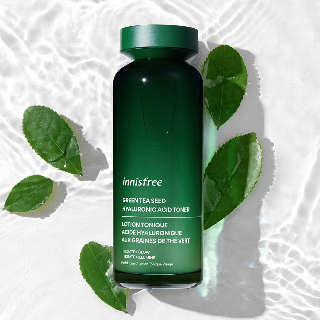 Green Tea Hyaluronic Acid Toner on watery background