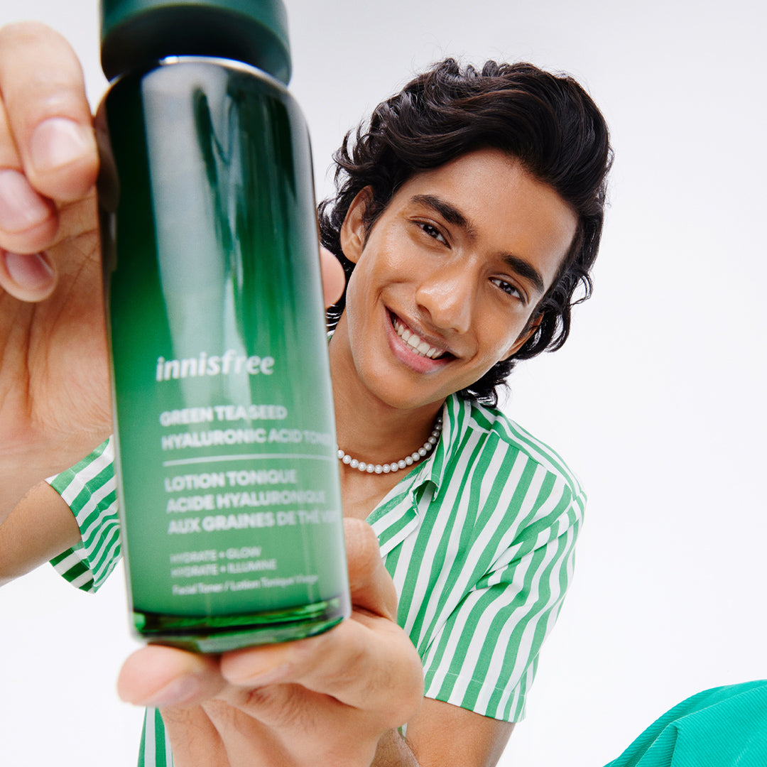 Green Tea Hyaluronic Acid Toner held by model