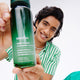 Enlarge image of Green Tea Hyaluronic Acid Toner held by model